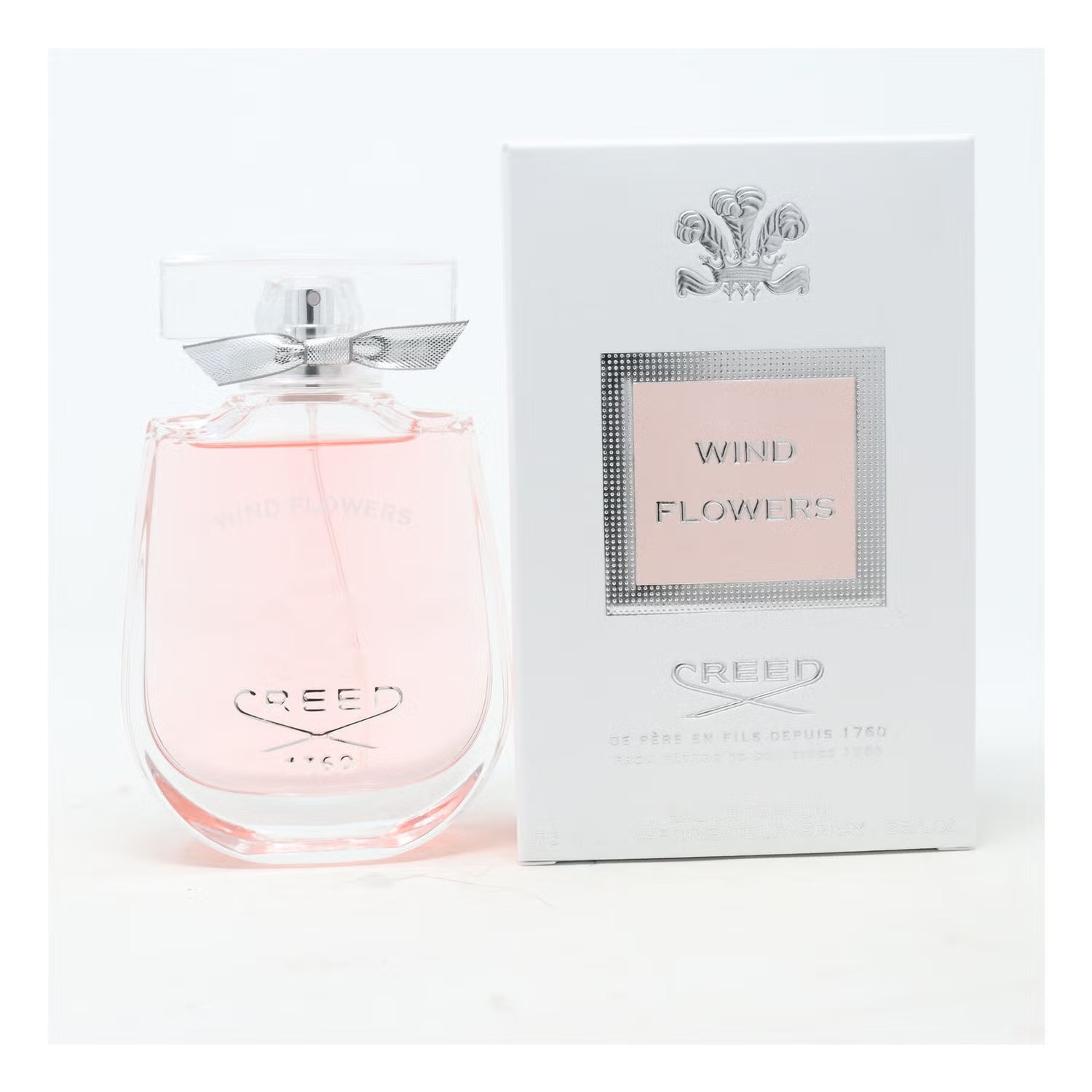 Creed Wind Flowers perfume bottle and packaging on a white background